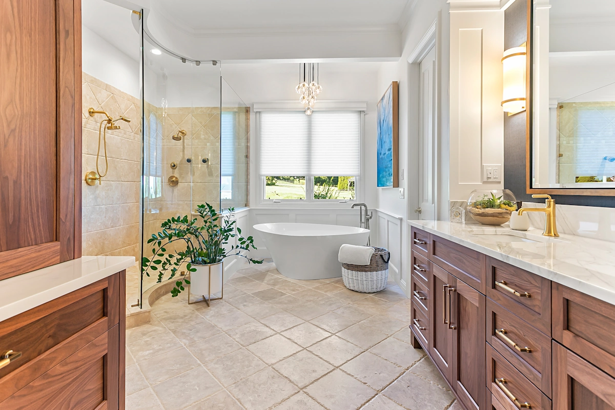 bathroom with sunken tub, walk in shower with glass doors, small modern chandelier and custom vanity